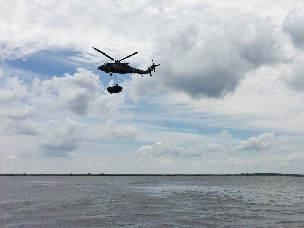 Transporting the bundle to the drop site in Bayou Sauvage.