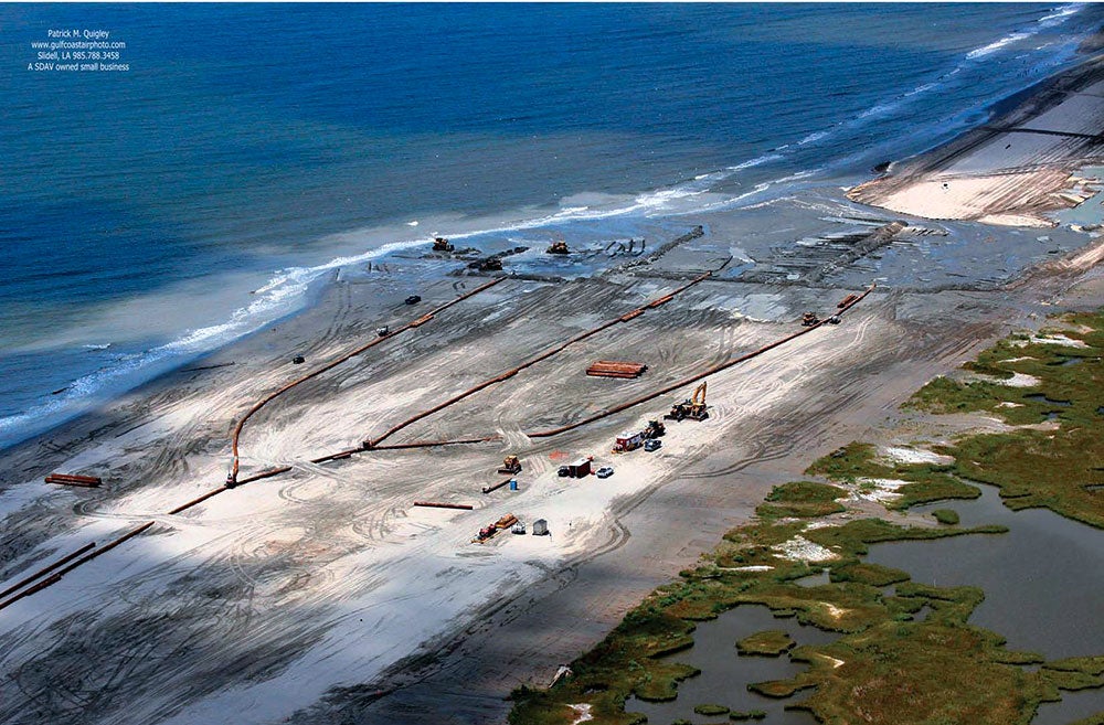 The continued deterioration of Caminada headland threatens thousands of acres of wetland habitat, as well as critical infrastructure. The project creates 300 acres of back barrier marsh and nourishes 130 acres of emergent marsh behind the Caminada beach using material dredged from the Gulf of Mexico. Photo: Patrick M. Quigley, Gulf Coast Air Photo