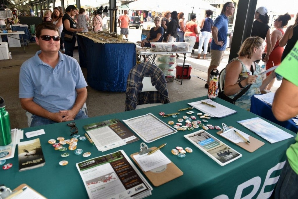 Richie Blink tabling for Restore the Mississippi River Delta at the French Market
