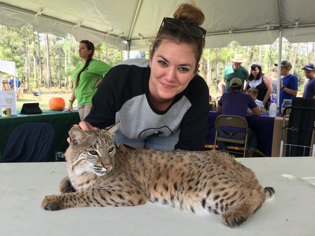 Sam the bobcat hanging out with Sam Carter the Outreach Coordinator.