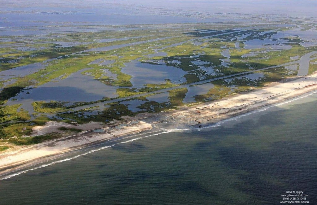 Caminada Headlands Barrier Island Creation - The continued deterioration of Caminada headland threatens thousands of acres of wetland habitat, as well as critical infrastructure. The project creates 300 acres of back barrier intertidal marsh and nourishes 130 acres of emergent marsh behind 3.5 miles of the Caminada beach using material dredged from the Gulf of Mexico. Photo: Patrick M. Quigley, Gulf Coast Air Photo